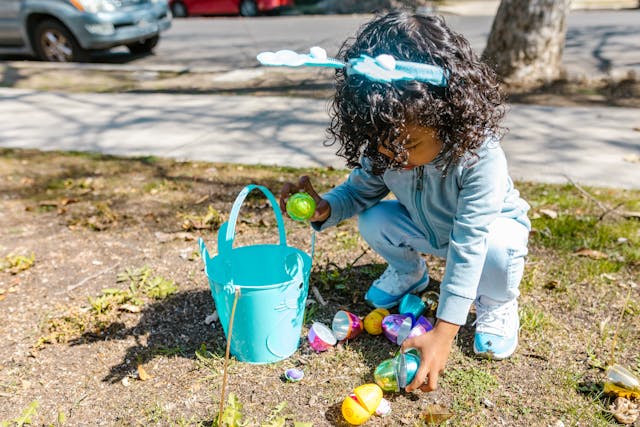 young girl on easter egg hunt trail